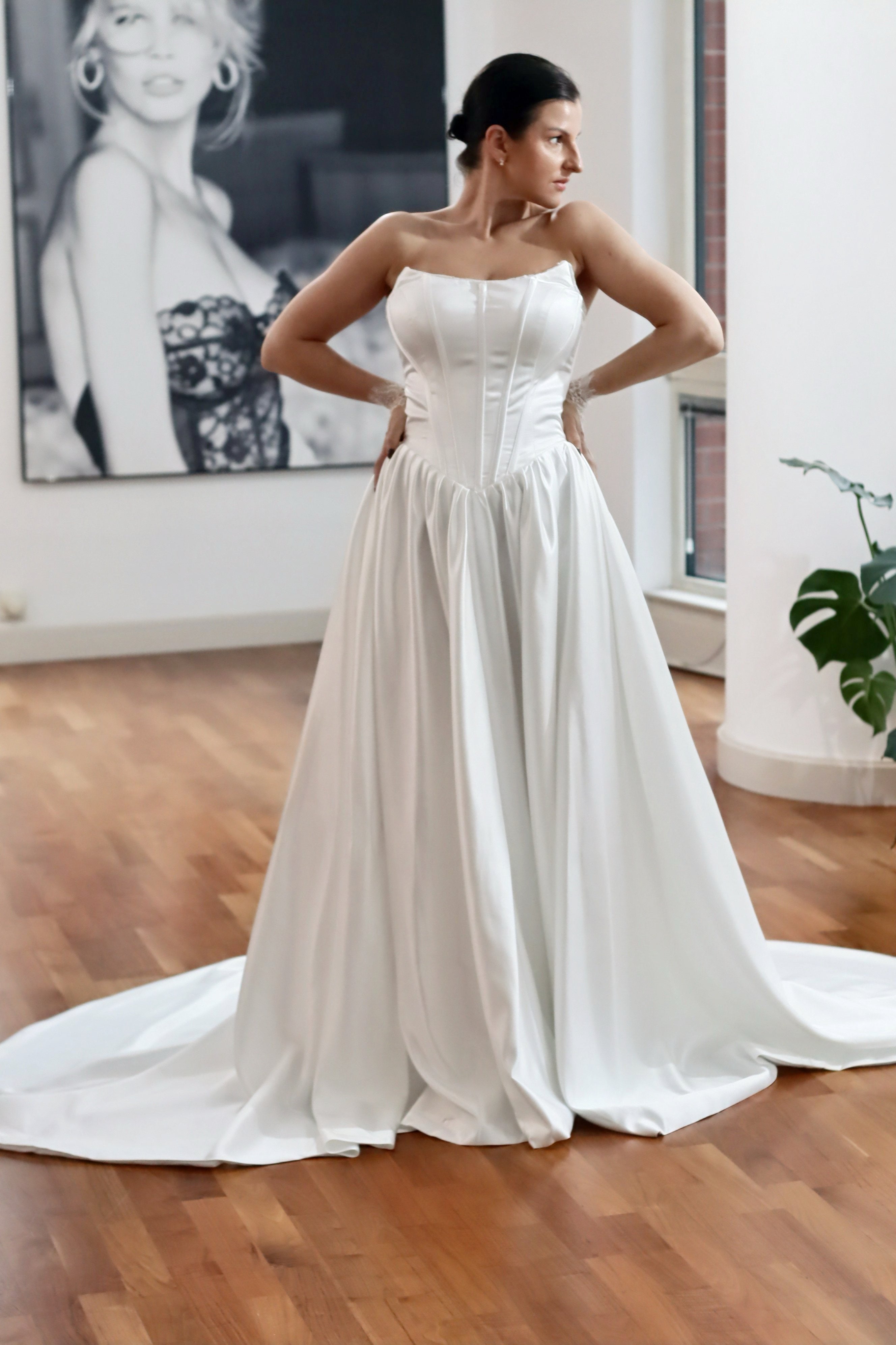 Basque waist satin wedding dress with pockets and train. Beautiful elegant satin bridal dress for the elegant and modern bride. Basque waist is the trendiest wedding dress style in the upcoming season.