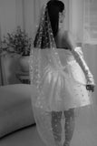 Mini Satin Wedding dress with 3d patterned wedding veil and detachable bridal sleeves. Chic and playful city hall wedding outfit.