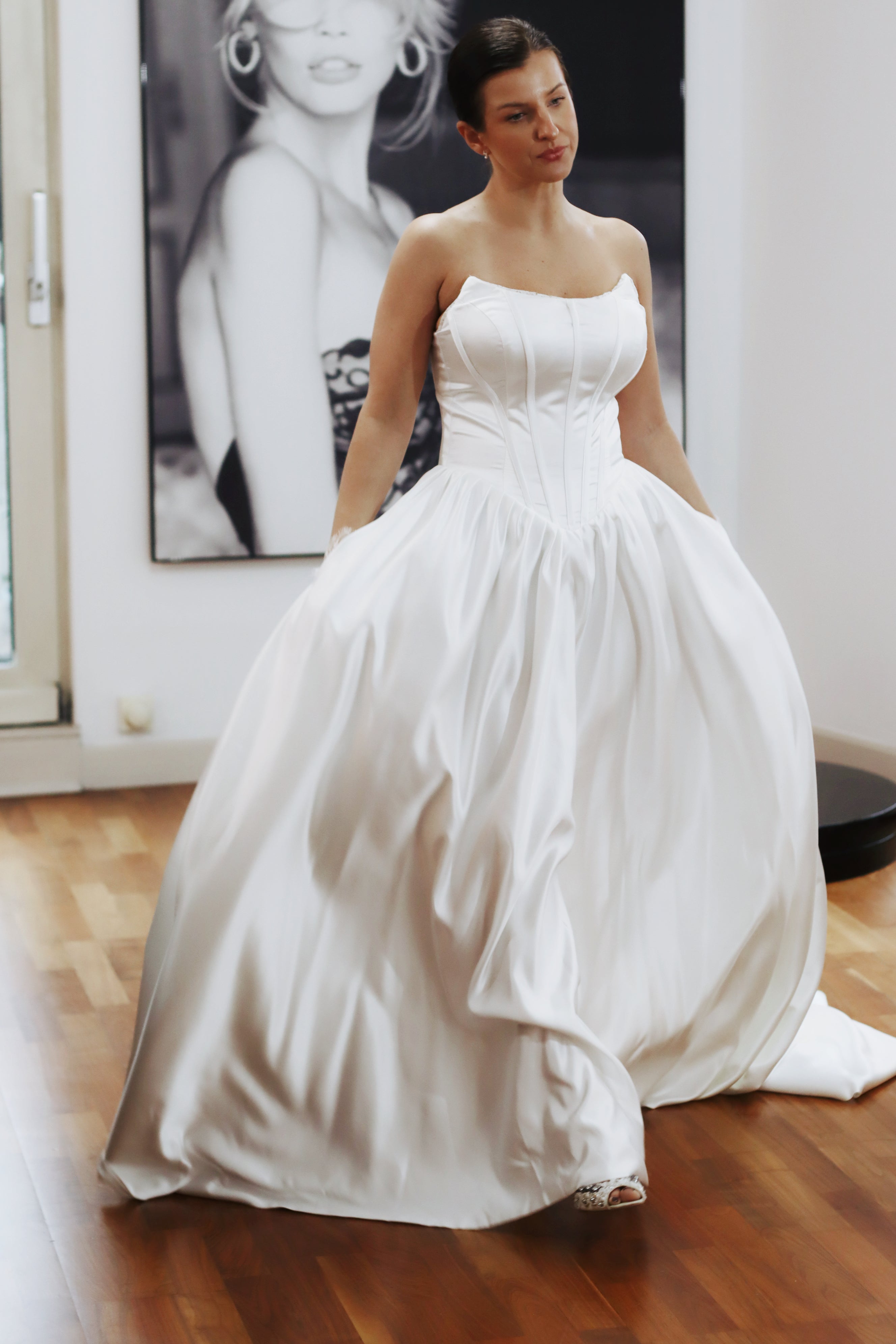 Basque waist wedding dress made from luxury satin fabric. This beautiful dress is available in try at home service for anyone looking for their dream wedding dress. It comes with pockets and lace up corset.