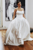 Basque waist wedding dress made from luxury satin fabric. This beautiful dress is available in try at home service for anyone looking for their dream wedding dress. It comes with pockets and lace up corset.