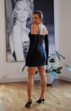 Black Detachable Satin Bridal Sleeves paired with black body con mini dress. These satin sleeves are a perfect accessory for a black tie event or to pair with black wedding dress.