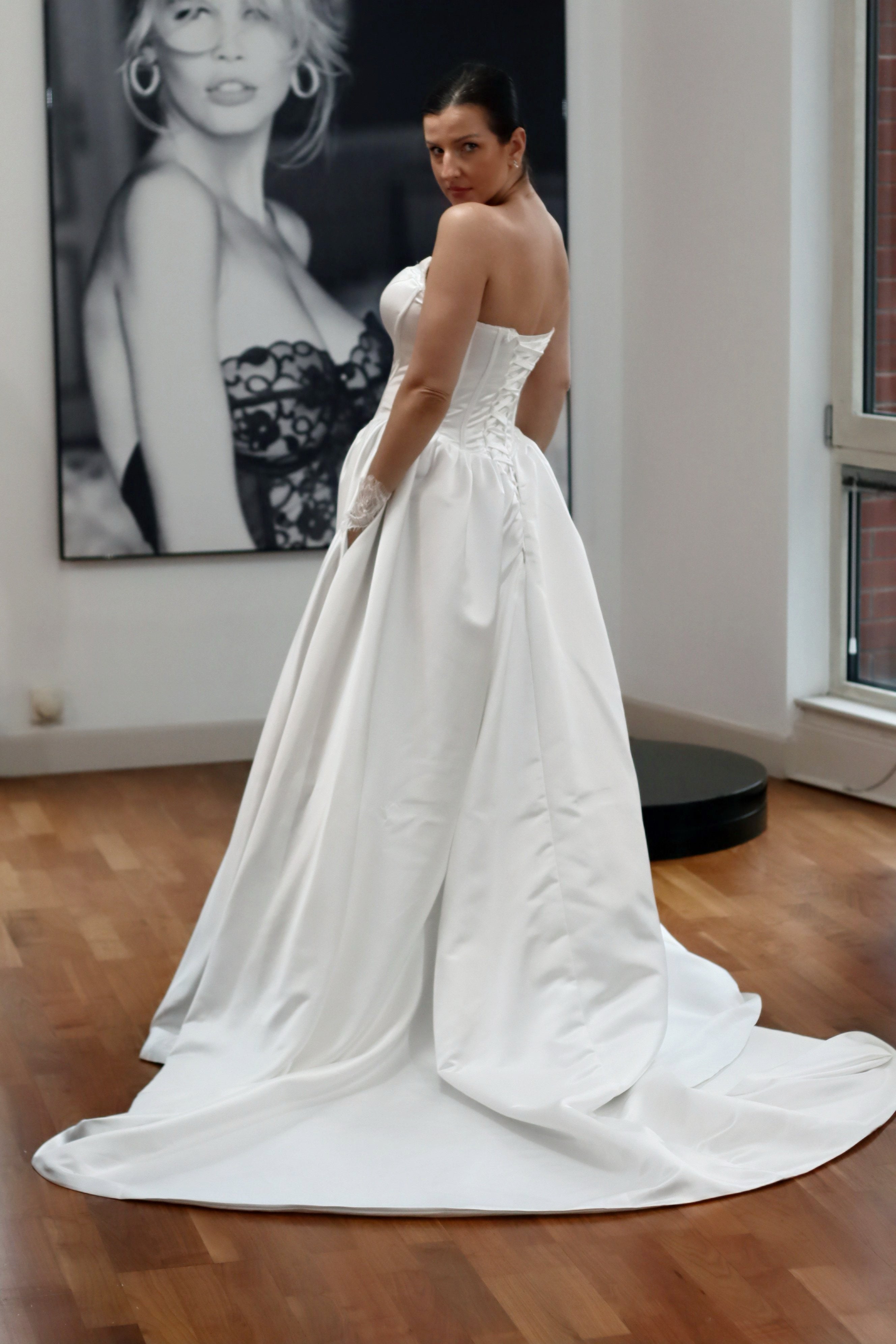 Basque waist satin wedding dress with pockets and train. Beautiful elegant satin bridal dress for the elegant and modern bride. Basque waist is the trendiest wedding dress style in the upcoming season.