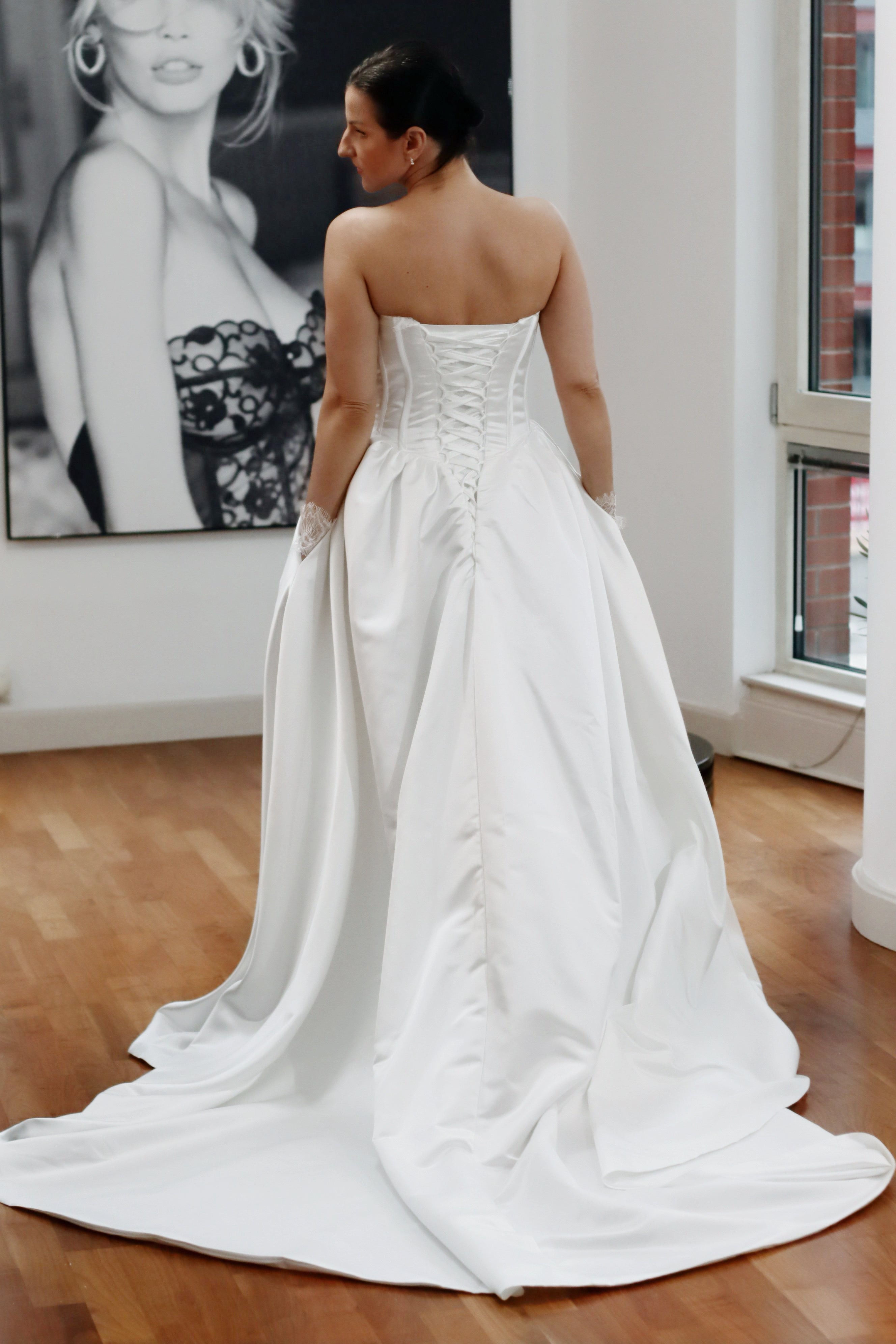 Basque waist satin wedding dress with pockets and train. Beautiful elegant satin bridal dress for the elegant and modern bride. Basque waist is the trendiest wedding dress style in the upcoming season.