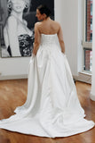 Basque waist satin wedding dress with pockets and train. Beautiful elegant satin bridal dress for the elegant and modern bride. Basque waist is the trendiest wedding dress style in the upcoming season.