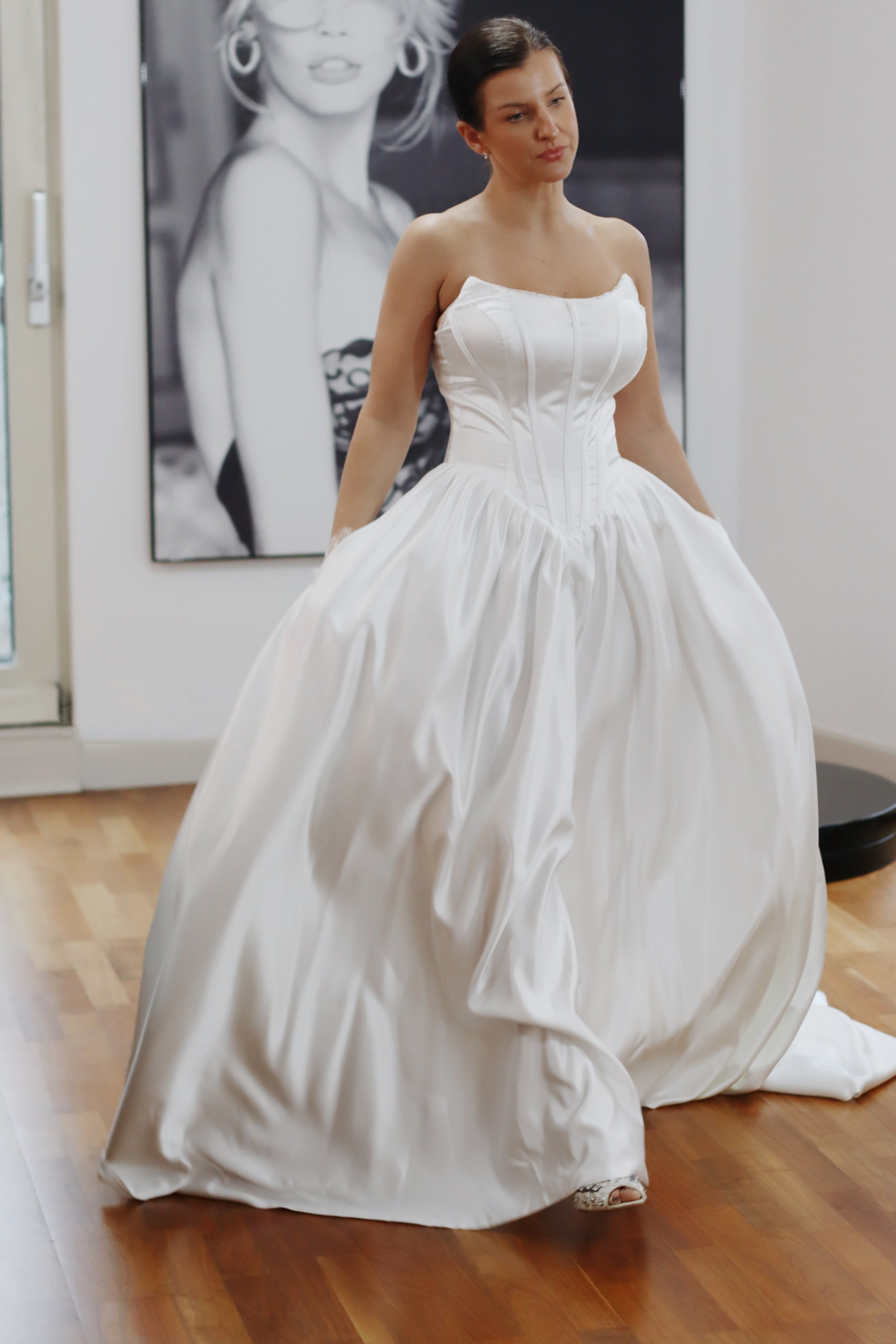 Basque waist satin wedding dress with pockets and train. Beautiful elegant satin bridal dress for the elegant and modern bride. Basque waist is the trendiest wedding dress style in the upcoming season.