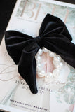 Large black velvet bow with pearl hair tie. Perfect holiday gift for a bride to be and a fashionista. Ideal Christmas Gift made from soft velvet. 