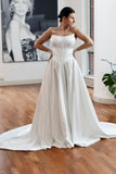 Basque waist satin wedding dress with pockets and train. Beautiful elegant satin bridal dress for the elegant and modern bride. Basque waist is the trendiest wedding dress style in the upcoming season. 