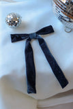 Add a touch of timeless elegance and sophistication to any occasion with our Blue Velvet Hair Bow withFrench Barrette. Measuring a striking 6 inches wide by 10 inches long, this luxurious hair bow is a perfect statement piece for weddings, parties, and festive celebrations. Crafted from rich, navy blue velvet fabric it exudes classic glamour while enhancing any hairstyle.