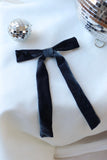 Add a touch of timeless elegance and sophistication to any occasion with our Blue Velvet Hair Bow withFrench Barrette. Measuring a striking 6 inches wide by 10 inches long, this luxurious hair bow is a perfect statement piece for weddings, parties, and festive celebrations. Crafted from rich, navy blue velvet fabric it exudes classic glamour while enhancing any hairstyle.