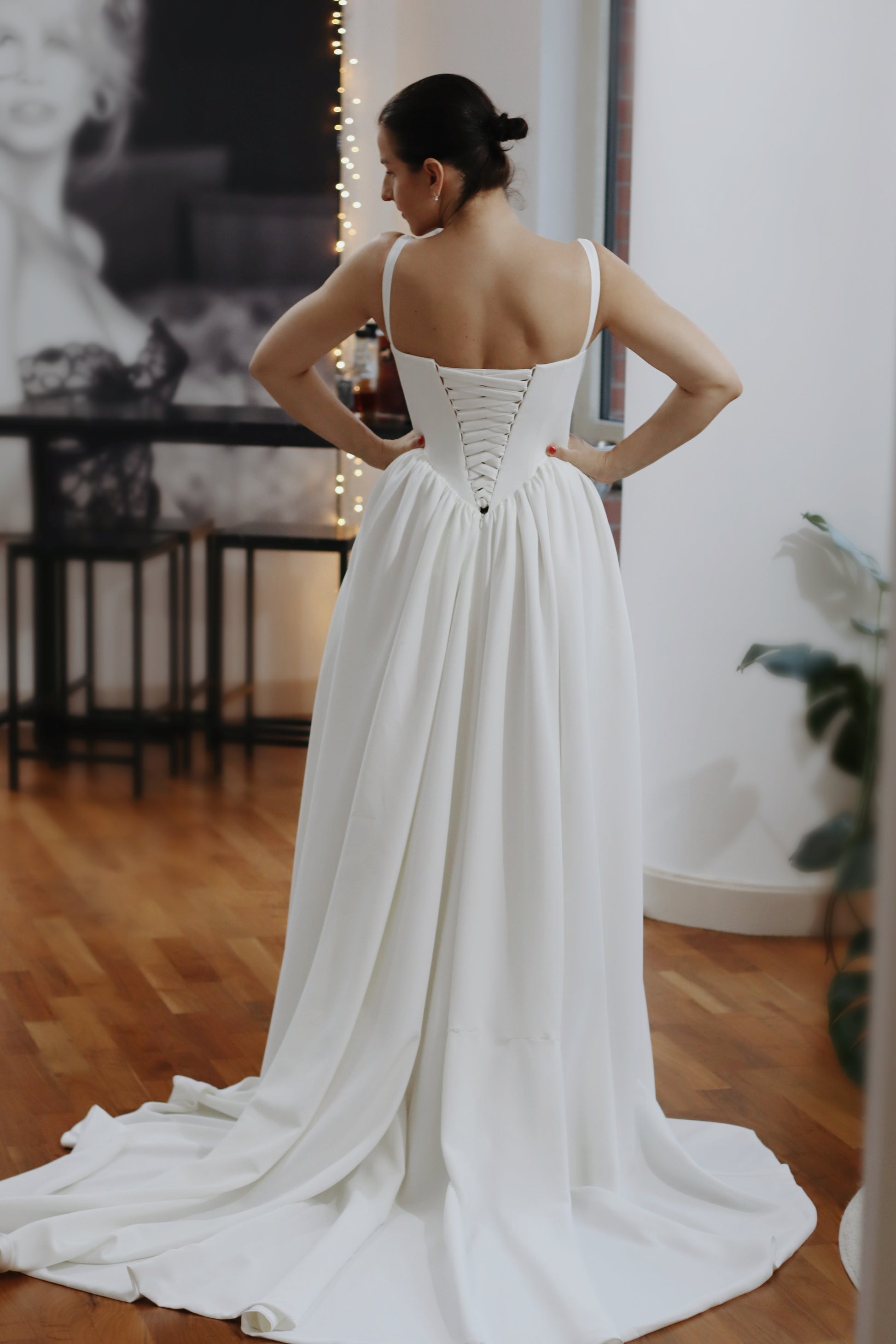 Introducing Hope - a newest addition to our luxury crepe wedding dress collection. &nbsp;Basque waist wedding dresses are leading the bridal fashion trends this year, with their signature V-shaped waistline captivating brides everywhere. Our luxury crepe basque waist bridal gown beautifully blends timeless charm with contemporary elegance, designed to make any bride feel exquisite. Crafted from premium crepe fabric, this gown offers a smooth, graceful drape that complements its striking silhouette.