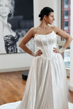 Basque waist satin wedding dress with pockets and train. Beautiful elegant satin bridal dress for the elegant and modern bride. Basque waist is the trendiest wedding dress style in the upcoming season. 