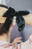 Large black velvet bow with pearl hair tie. Perfect holiday gift for a bride to be and a fashionista. Ideal Christmas Gift made from soft velvet. 