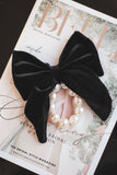 Large black velvet bow with pearl hair tie. Perfect holiday gift for a bride to be and a fashionista. Ideal Christmas Gift made from soft velvet. 