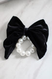 Large black velvet bow with pearl hair tie. Perfect holiday gift for a bride to be and a fashionista. Ideal Christmas Gift made from soft velvet. 